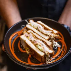 My Buttermilk Fried Chicken Sandwich is pure comfort. A crispy, juicy chicken cutlet is tucked into soft bread with a tangy sauce. It’s the kind of sandwich that makes any day better.