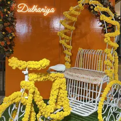 Bringing the classic 'Dil Wale Dulhaniya Le Jayenge' feel to life for a Haldi ceremony. We used a cycle rickshaw decorated with bright marigolds and a custom 'Dulhaniya' neon sign for the perfect fun and traditional photo op.
