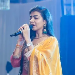 A close-up of me singing at the Ganpati Mahotsav. I feel truly blessed to be able to offer my voice in service to Bappa during such auspicious celebrations.
