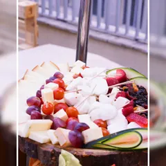 Our cheese skewers are a guest favorite, combining cubes of feta and other artisanal cheeses with fresh grapes, cherry tomatoes, and strawberries for an easy-to-eat, flavorful bite.