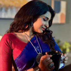 Another angle of the on-set makeup, highlighting the subtle eye makeup and defined brows that complete this polished character look for the television series.