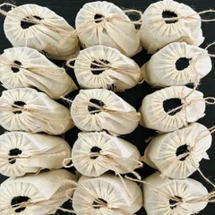 A large order of my handmade products ready for a corporate event. Each item is individually packed in an eco-friendly cloth pouch, showing that even bulk orders have a personal, handcrafted touch.