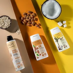A top-down flat lay for Taupe's skincare line, showcasing the products alongside their natural ingredients like oats, almonds, and coconut. This visual strategy clearly communicates the brand's commitment to natural formulations.