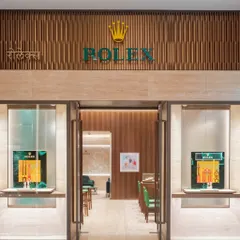 The entrance to the Rolex flagship boutique in Mumbai is designed with restraint and sophistication. Warm wood tones and travertino cladding create a welcoming yet exclusive feel, resonating with Rolex's global ethos of timeless elegance.