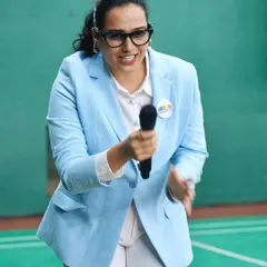 Bringing the hype to a corporate sports league. Dressed in a professional yet approachable blazer, I love engaging with participants and building excitement. It shows how I can adapt my energetic style to a corporate setting, making it fun yet focused.