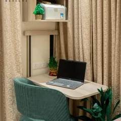 A close-up of the custom-designed study nook. We ensure even the smallest corners are utilized effectively, with dedicated shelving for a printer and other essentials, making work-from-home a breeze.