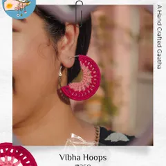 A close-up of the 'Vibha' hoops in a beautiful magenta. The two-tone design adds a little extra detail, all while being super lightweight thanks to the cotton yarn.