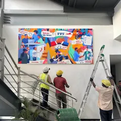 Here is the final mural installed at the TVS Motor Company office. This large-scale artwork serves as a permanent and powerful reminder of the team's shared values, transforming a simple staircase into a gallery of corporate identity and pride.