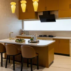 The fluted detail on the island base adds texture and sophistication to this modern, open-plan kitchen.