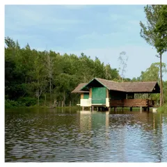 A tranquil pavilion on the water at Gorukana Resort. This space provides a serene spot for guests to connect with the peaceful surroundings and enjoy the beauty of the lake.