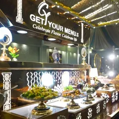 An overview of one of our elegant buffet counters. The combination of black, gold, and intricate patterns creates a luxurious and modern look for any celebration.