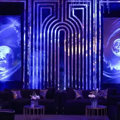 For this celestial-themed cocktail night, I designed a lounge backdrop with two glowing moons set against a cosmic sky, flanked by a modern, geometric mirrored panel.