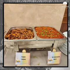 A New Year's spread featuring some of our popular vegetarian main courses: crispy Paneer Fingers and a flavorful Veg Manchurian Gravy.