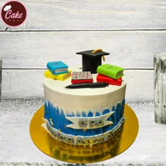 A perfect cake to celebrate a major career achievement. This CPA graduation cake is topped with edible books, a calculator, and a graduation cap.
