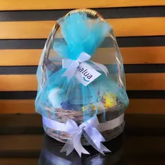A 'Mom-to-be' hamper curated for a corporate client to gift their employees. This beautiful basket is wrapped in blue tulle and filled with goodies to pamper the expectant mother.