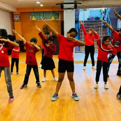 The whole team hitting the dab pose. This photo captures the fun, modern, and playful energy of my kids' dance classes.