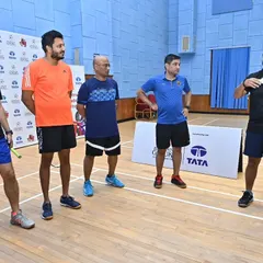 Our coaches briefing a group of adult players before a match at our intra-academy tournament, highlighting the active adult community at our centers.