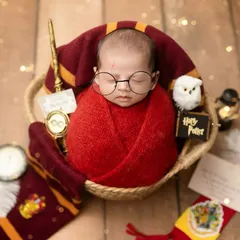 For the fans of magic, we present our Harry Potter themed newborn shoot. We have all the props, from the Gryffindor scarf and wand to the iconic round glasses, to bring a little bit of Hogwarts to your baby's first photos.
