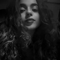 A raw, black and white close-up. This is the intensity and focus I bring to my craft. It's about sound, sweat, and vision, ready to give it my all for the dance floor.