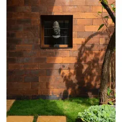 I used bricks imported from Bali for this feature wall. The way the sun hits them adds a beautiful warmth and texture, enhancing the tropical feel of the home.