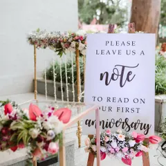 I love this heartwarming idea from a creative couple. We set up a station with a sign asking guests to leave a note for them to read on their first anniversary, creating a beautiful keepsake from their special day.