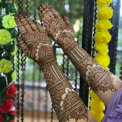 A full bridal design, created with love and dua. Every line, from the delicate paisleys to the fine checks, is drawn to celebrate your unique story. This is a classic intricate Indian bridal henna, covering the arms for a complete look.