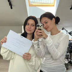Another successful student proudly holding her certificate. It is a joy to share our knowledge and help talented individuals launch their careers in the beauty industry.
