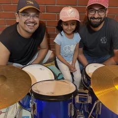 A happy moment with our student Inara and her instructors. Building a positive and encouraging community is at the heart of everything we do.
