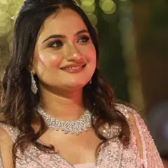 A close-up of the bride's reception makeup. The look is soft and romantic, with a touch of sparkle on the eyes to catch the light.