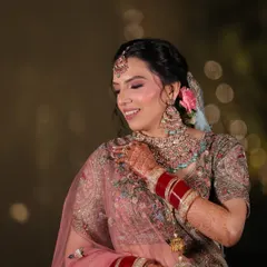 The joy of a modern bride. Muskaan's look is a beautiful example of how pastel outfits can be paired with soft, glowing makeup for a fresh and elegant wedding day style.