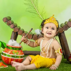 Another adorable shot from a Janmashtami session, with our little Krishna ready to cause some mischief with his pot of butter.