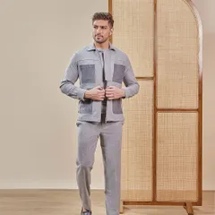 Arrive in a shacket and trouser set that blends ease with an urban edge. This grey monochrome look features statement pockets and tailored comfort, making it both functional and fashionable.