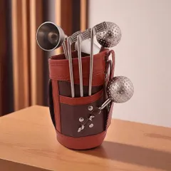 A closer look at the Golf Miniature Bar Kit. The set includes a jigger, tongs, and stirrers shaped like golf clubs and balls, all neatly stored in a detailed faux leather golf bag.