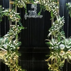 A surprise 50th birthday party planned with love by the guest of honor's husband and daughters. I designed this classic black and gold theme with lush white florals to create an elegant and celebratory atmosphere for friends who flew in from around the world.