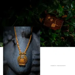 An artistic still-life of the bride's traditional gold necklace and other wedding details, captured with a creative eye.