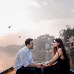A quiet moment on the water as the sun sets. I use the soft, golden hour light to paint a serene and romantic picture, capturing the peaceful feeling of being with the one you call home.