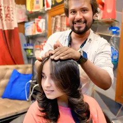 The final look of a beautifully layered haircut with a smooth, polished blowout. The layers are designed to fall perfectly, creating a sleek and sophisticated style.