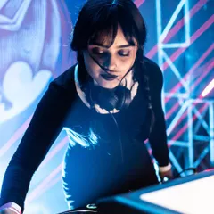 A close-up from my Halloween set as Wednesday Addams. The details matter, from the makeup to the music, to fully transport everyone into the theme of the night. This is what makes a themed event an immersive experience.