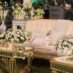 I designed intimate lounge areas with plush ivory sofas and mirrored gold tables. These spaces were surrounded by abundant white chrysanthemums, offering guests a comfortable and beautiful spot to soak in the ghazal music.