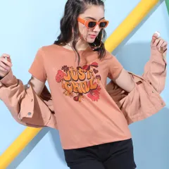 A 'Just Chill' graphic tee styled with black shorts and a matching jacket. This look is perfect for casual outings and showcases how to layer pieces for a versatile outfit.
