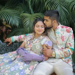 A sweet moment between the couple at their pool party. The bride-to-be's makeup is soft and glamorous, perfect for a fun, outdoor event.