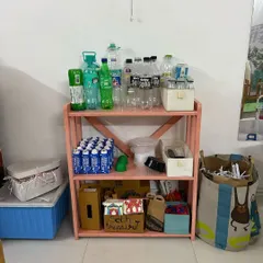 A collection of plastic bottles, cartons, and other household recyclables becomes a treasure trove of building materials. This practice fosters sustainability and resourcefulness from a young age.
