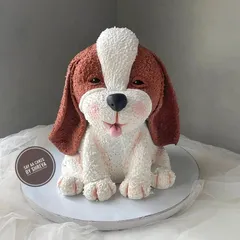 This cake was a special project to create a lifelike, sculpted puppy, and it's one of my favorites. I used detailed piping techniques to create the realistic fur texture, making this 3D dog cake a heartwarming and completely edible tribute for a pet lover.