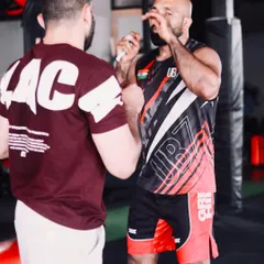 Personal attention is key. Here, I'm explaining the finer points of a striking combination to a student during our MMA certification course.