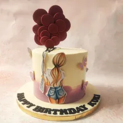 We capture a feeling of carefree joy with this girly balloon cake. A hand-drawn girl holding a large bunch of red balloons is the star, with delicate butterflies fluttering around the base, creating a whimsical and artistic birthday design.