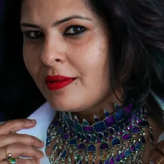 I never dreamed of success, I worked for it. Styling a simple white shirt with a statement Arabic-style choker necklace for a bold, high-fashion look.