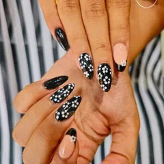 Another angle of this chic black and white floral set. The placement of the patterns and the negative space French tip make this a modern and stylish choice.