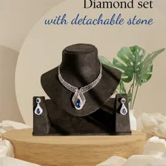 The same diamond set, now featuring a deep blue sapphire. This demonstrates the versatility of the piece, allowing you to match your jewellery to your outfit and occasion.