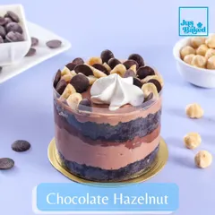 For the ultimate chocolate lover, the Chocolate Hazelnut mini dessert is a dream. It's layered with chocolate sponge, hazelnut mousse, and topped with chocolate chips and hazelnuts.