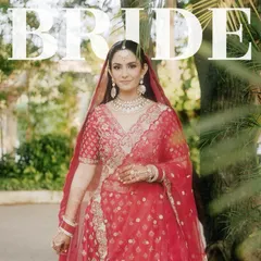 A classic bridal portrait with the bride looking directly at the camera, framed by lush greenery. The "BRIDE" text overlay makes a bold statement.